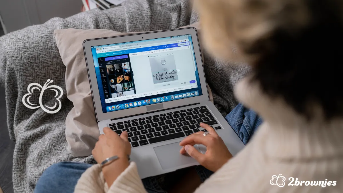 Woman creating a design on her laptop using Canva